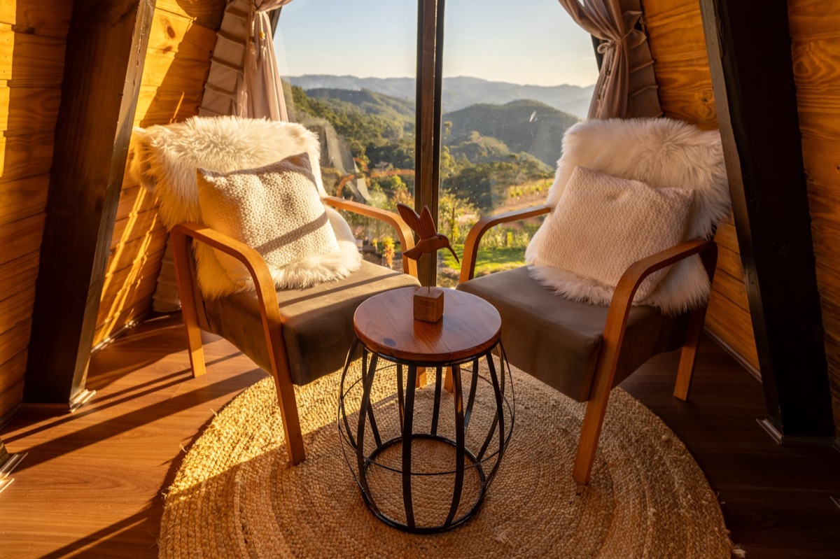 Safari lodge interior with comfortable beds and views