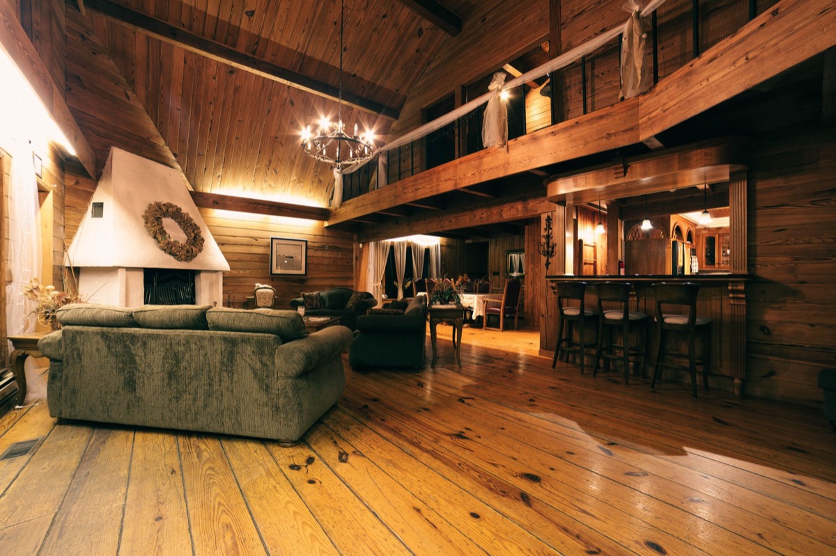 Safari lodge interior with wooden furniture and views outside